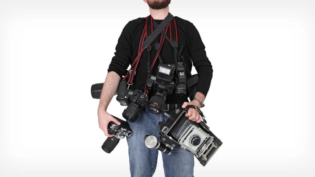 A Man Holding Photography Equipment